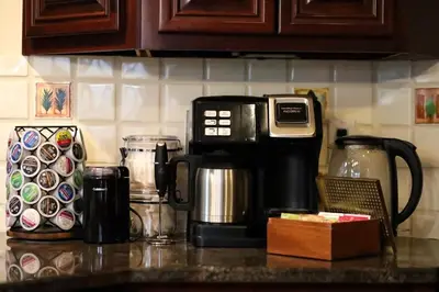 a kitchen counter with a coffee maker and a coffeemaker at Poconos Playtime Paradise Luxury Play Escape in Pocono Pines