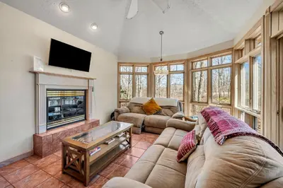 a living room with two couches and a fireplace at Poconos Playtime Paradise Luxury Play Escape in Pocono Pines