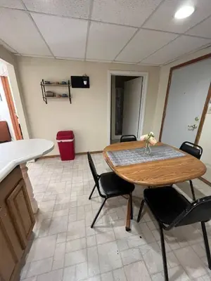a dining room with a table and some chairs at Comfy Apt near Guthrie RPH Sayre in Sayre