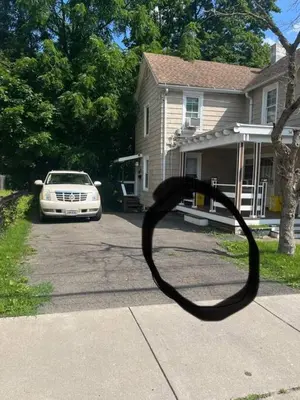 a car parked in the driveway of a house at Intimate 1 Bedroom Apt by UHS in Binghamton
