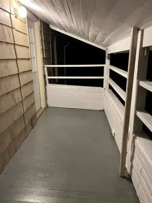 an empty walkway in a building with a garage at Intimate 1 Bedroom Apt by UHS in Binghamton