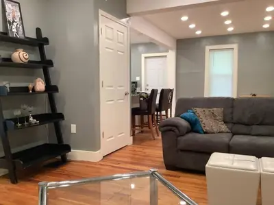 a living room with a couch and a table at Spacious Inviting Home by BU UHS & Guthrie in Johnson City