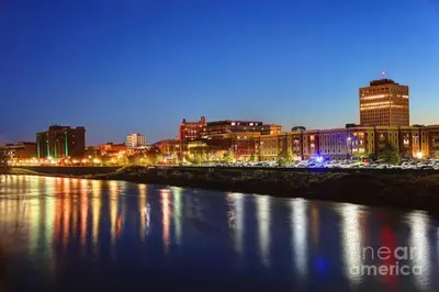 a city at night with a river and buildings at Spacious 3 bed by Wilson, Lourdes Hospitals near Vestal in Johnson City