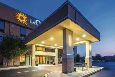 a hotel building with a sign on top of it at La Quinta by Wyndham Mechanicsburg - Harrisburg in Mechanicsburg