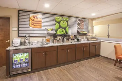 a kitchen with a counter with a drink dispenser at La Quinta by Wyndham Mechanicsburg - Harrisburg in Mechanicsburg