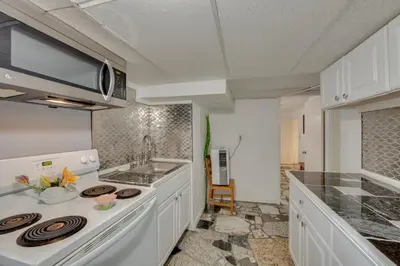 a kitchen with a sink and a stove top oven at 2 Mi to Hersheypark Group Getaway with Deck in Hummelstown