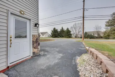 a white door on the side of a house at 2 Mi to Hersheypark Group Getaway with Deck in Hummelstown