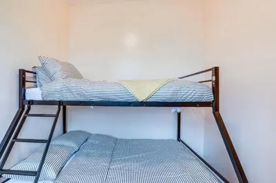 a small bunk bed in a room with at Comfy Bayonne Townhome about 11 Mi to NYC Attractions in Bayonne