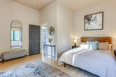 a bedroom with a large bed and a window at Secluded Kerhonkson Retreat with Deck and Views! in Sundown