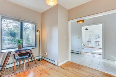 an empty living room with a desk and a window at Secluded Kerhonkson Retreat with Deck and Views! in Sundown