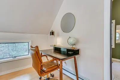 a desk with a mirror and a chair in a room at Secluded Kerhonkson Retreat with Deck and Views! in Sundown
