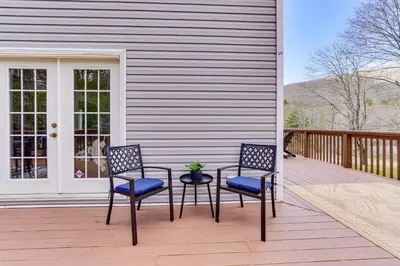 two chairs and a table on a porch at Secluded Kerhonkson Retreat with Deck and Views! in Sundown