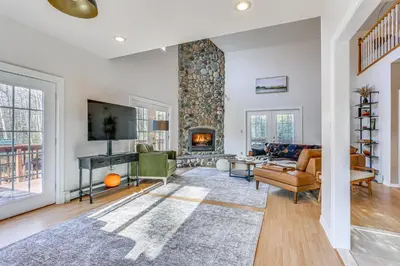 a living room with a fireplace and a tv at Secluded Kerhonkson Retreat with Deck and Views! in Sundown