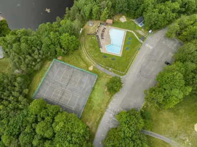 an aerial view of a solar farm in the forest at Cozy cottage in the heart of pocono in Long Pond