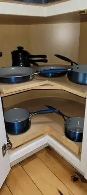 a shelf with pots and pans on top at Comfy Log Cabin Family & Pet Kind by State & Waterparks! in Tobyhanna