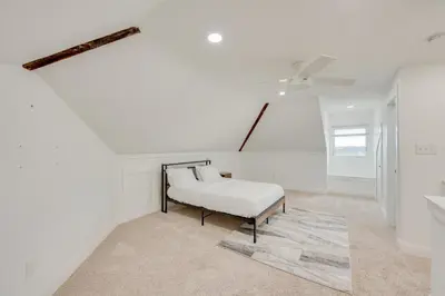 a white room with a bed and a ceiling fan at 15 Mi to Amish Village Cozy Lancaster Apt! in Lancaster