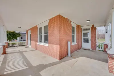 a red brick building with a white door at 15 Mi to Amish Village Cozy Lancaster Apt! in Lancaster