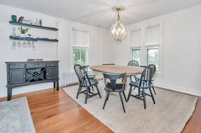 a dining room with a table and chairs at Underground Railroad 3 Bedroom Farmhouse in Kennett Square