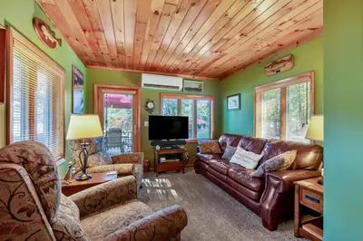 a living room with a couch and a tv at Lakeview Retreat in Lakeville