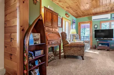 a room with a desk and a chair and a tv at Lakeview Retreat in Lakeville