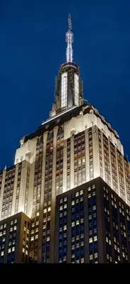 a tall building with a tower on top of it at Unique Place in midtown NYC in New York