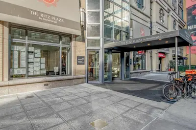 a building with bikes parked outside of a store at Midtown 1br w doorman wd nr Times Square NYC-1351 in New York