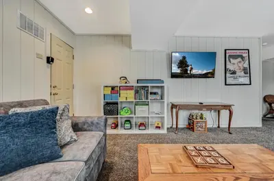 a living room with a couch and a table at Poconos Paradise Lakeskihikewater Parkkids in Lake Harmony
