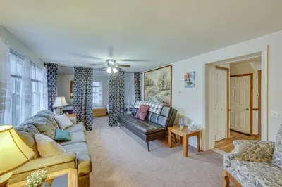 a living room with a couch and a chair and a table at Tranquil Mt Pleasant Mills Retreat on 60-Acre Farm in Dalmatia