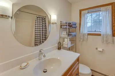 a bathroom with a sink and a mirror at Tranquil Mt Pleasant Mills Retreat on 60-Acre Farm in Dalmatia