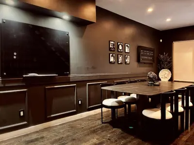 a dining room with a table and a flat screen tv at Trio Sonata, 3-Bed Rock n Roll Residence in Northern Liberties in Philadelphia