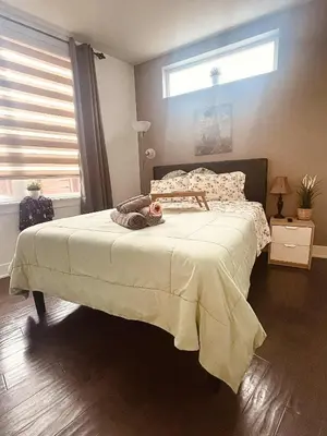 a bedroom with a bed with a teddy bear on it at Bright, Cozy Room Near Center City Philadelphia and Museums in Philadelphia