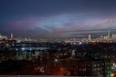 a view of a city at night with lights at Bright and Bold Escape with NYC Views and Free Parking, Sleeps 9 and 2 Baths in Newark