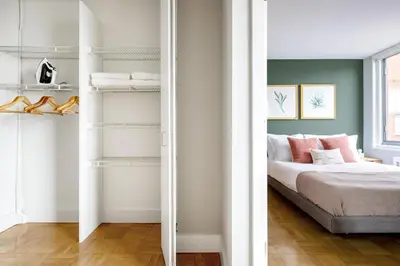 a bedroom with a bed and a closet at Kips Bay 1BR w Doorman Elevator Gym NYC-478 in New York