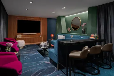 a living room with a blue couch and a tv at Financial District 1br w WD gym elevator NYC-1376 in New York
