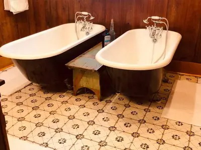 two bath tubs sitting next to each other in a bathroom at Church Bells in Wyalusing
