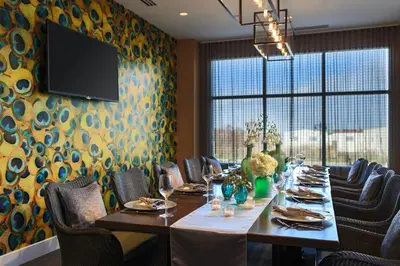 a dining room with a long table and chairs at Courtyard by Marriott Philadelphia Lansdale in Lansdale