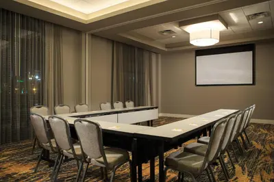 a conference room with a long table and chairs at Courtyard by Marriott Philadelphia Lansdale in Lansdale