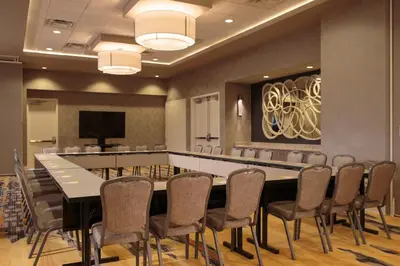 a conference room with a large table and chairs at Courtyard by Marriott Philadelphia Lansdale in Lansdale