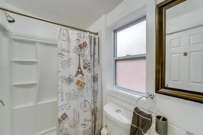 a bathroom with a toilet and a shower curtain at Updated Minersville Townhome by ATV Trail! in Mount Pleasant