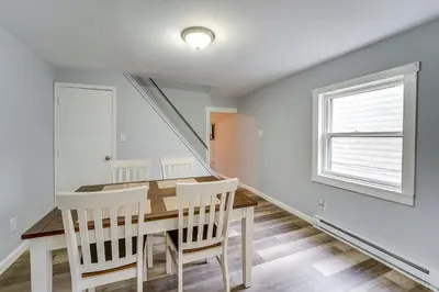 a dining room with a table and chairs and a window at Updated Minersville Townhome by ATV Trail! in Mount Pleasant