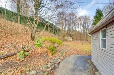 a home with a driveway next to a house at Updated Minersville Townhome by ATV Trail! in Mount Pleasant