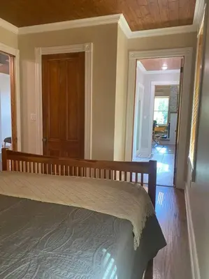 a bedroom with a large bed in a room at Triple Brick on Main in Wyalusing