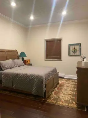 a bedroom with a bed and a window at The Cast Iron Lady in Wyalusing