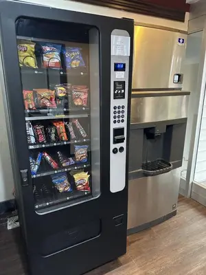 a vending machine filled with lots of snacks at HomeTowne Studios by Red Roof Lancaster in Lancaster