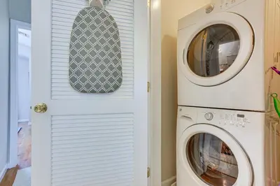 a laundry room with a washer and dryer at Bayfront New Jersey Escape about 13 Mi to Times Square in Bayonne