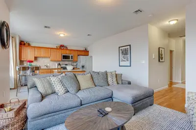 a living room with a couch and a table at Bayfront New Jersey Escape about 13 Mi to Times Square in Bayonne