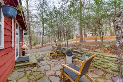 a patio with two chairs and a table at Cozy Lake Wallenpaupack Cabin with Community Perks in Lake Ariel