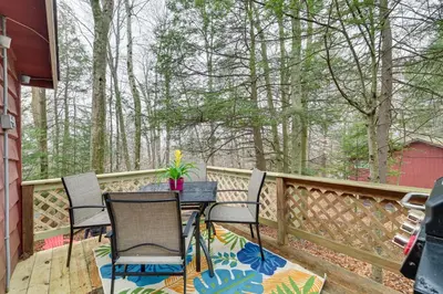 a patio with chairs and a table on a deck at Cozy Lake Wallenpaupack Cabin with Community Perks in Lake Ariel