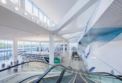 a large building with a escalator in a mall at Free Parking in Prime Area w King bd in Newark