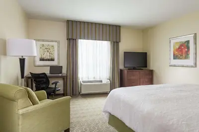 a hotel room with a bed and a television at Hampton Inn & Suites Philadelphia Montgomeryville in North Wales